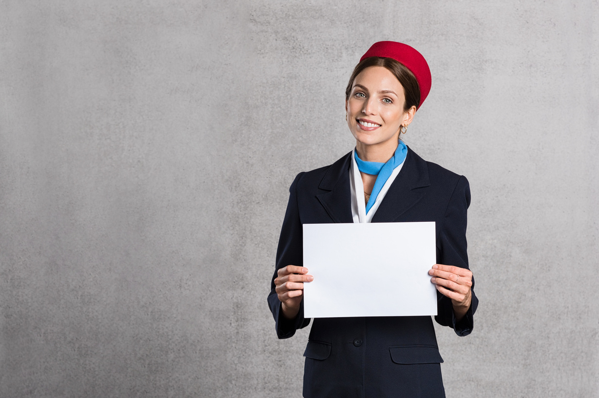 Flight Assistant Holding White Sign